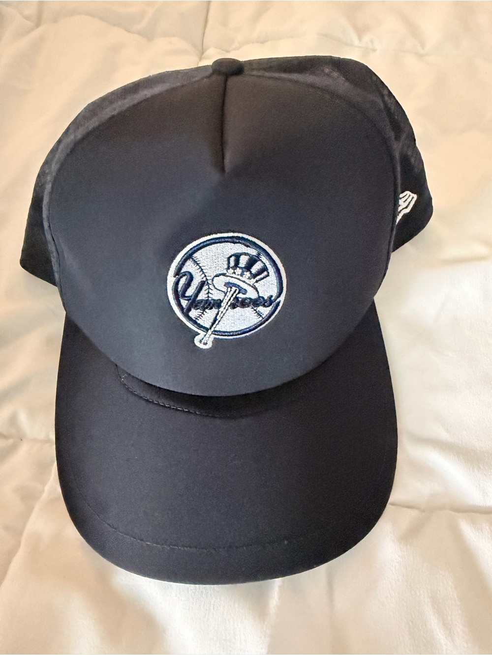 New Era Black Baseball Cap with White Embroidered Logo